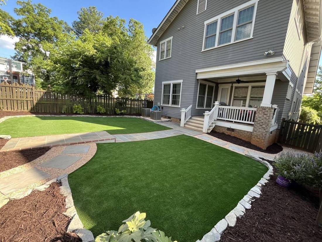 After: curved turf lawn, stone edging, gravel and stepping stones