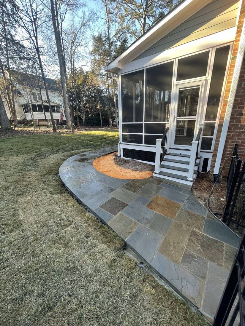 Curved flagstone walkway at a screened porch entry