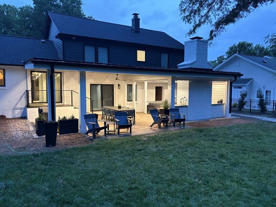 Finished backyard patio and covered porch at dusk